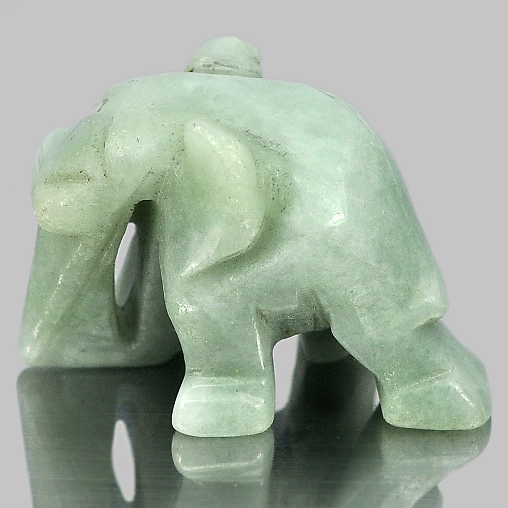 Natural Green Jade 59.25 Ct. Elephant Carving Size 27 x 19 Mm. Gemstone: Product ID: 819812971 Product Name: Natural Jade Weight: 59.25 CT. Size: 27 x 19 x 17 MM. Shape: Elephant Carving Color: Green Clarity:Opaque Luster: Good Gems Origin: Thailand Treatment: Unheated Cry