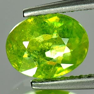 Natural Green Titanium Sphene Red Spark 1.31 Ct. Oval Shape 7.7 x 6 Mm. Gemstone From Madagascar: Product ID: 806504813 Product Name: Natural Sphene Weight: 1.31 CT. Size: 7.7 x 6 x 3.4 MM. Shape: Oval Color: Green With Rainbow Spark Clarity:SI1 Luster: Good Gems Origin: Madagascar Treatment: Unhe