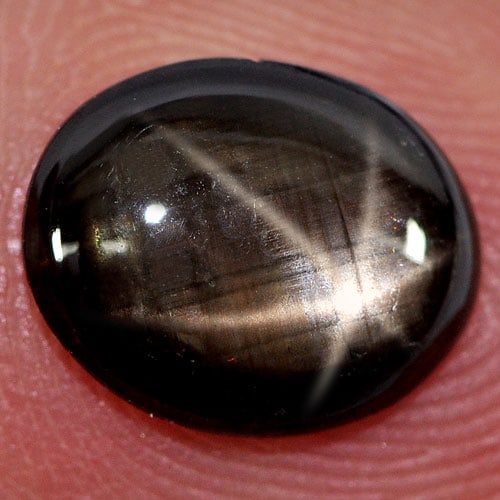 Natural Black Star Sapphire 6 Rays 2.45 Ct. Oval Cabochon Shape 9.7 x 8 Mm Gemstone From Thailand: Product ID: 806147742 Product Name: Natural Star Sapphire Weight: 2.45 CT. Size: 9.7 x 8 x 2.8 MM. Shape: Oval Cabochon Color: Black Clarity:Opaque Luster: Good 6 Rays Star Gems Origin: Thailand Treat