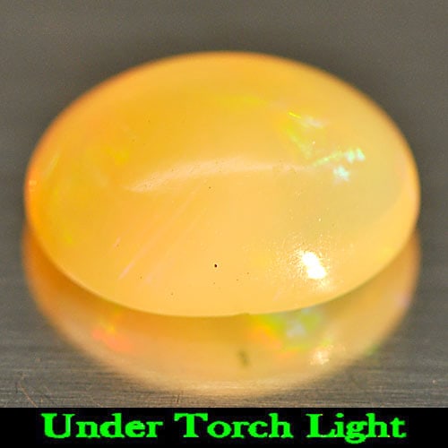 Multi Color Play Of Colour Opal 1.14 Ct. Oval Cabochon 9.1 x 6.2 Mm. Natural Gemstone From Ethiopia: Product ID: 818725562 Product Name: Natural Opal Weight: 1.14 CT. Size: 9.1 x 6.2 x 4.2 MM. Shape: Oval Cabochon Color: Multi-Color Clarity:Semi - Transparent Luster: Iridescent Gems Origin: Ethiopia 
