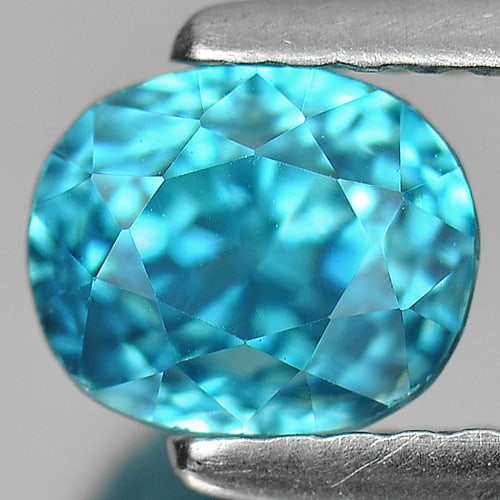 Natural Blue Zircon 1.86 Ct. Clean Oval Shape 6.3 x 5.3 Mm. Gemstone From Cambodia: Product ID: 807720904 Product Name: Natural Zircon Weight: 1.86 CT. Size: 6.3 x 5.3 x 5.3 MM. Shape: Oval Color: Blue Clarity:IF Luster: Very Good Gems Origin: Cambodia Treatment: Heated Crystal Struc