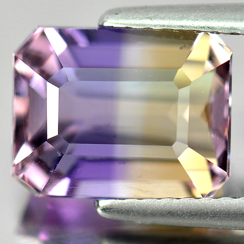 Natural Bi Color Ametrine 3.67 Ct. VVS Octagon Shape 9.7 x 7.6 Mm. Gemstone From Bolivia: Product ID: 800404966 Product Name: Natural Ametrine Weight: 3.67 CT. Size: 9.7 x 7.6 x 6.2 MM. Shape: Octagon Color: Bi Color Clarity:VVS Luster: Good Gems Origin: Bolivia Treatment: Unheated Crystal