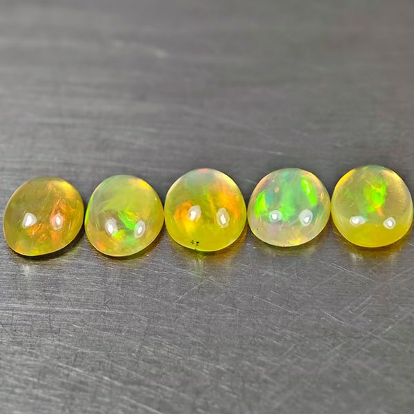 Natural Multi-Color Play Of Colour Opal 3.22 Ct. 5 Pcs Oval Cabochon Shape 8 x 6.2 Mm Gemstones From: Product ID: 818728041 Product Name: Natural Opal Weight: 3.22 CT. Size: 8 x 6.2 x 2.7 MM. Shape: Oval Cabochon Color: Multi-Color Clarity:Semi - Transparent Luster: Good Gems Origin: Ethiopia Treatmen