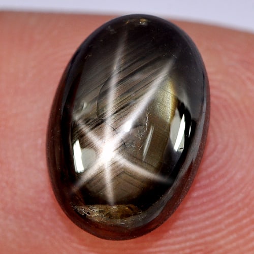 Natural Black Star Sapphire 6 Rays 7.55 Ct. Oval Cabochon Shape 12.8 x 8.8 Mm Gemstone From Thailand: Product ID: 806142806 Product Name: Natural Star Sapphire Weight: 7.55 CT. Size: 12.8 x 8.8 x 5.7 MM. Shape: Oval Cabochon Color: Black Clarity:Opaque Luster: Good 6 Rays Star Gems Origin: Thailand Tr