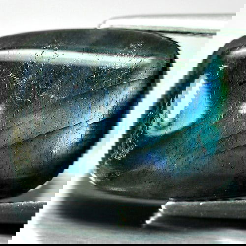 Natural Multi Color Blue Labradorite Doublet 9.93 Ct. Baguette Cabochon Shape 16.2 x 12 Mm. Gemstone: Product ID: 804301209 Product Name: Natural Labradorite Weight: 9.93 CT. Size: 16.2 x 12 x 5.4 MM. Shape: Baguette Cabochon Color: Multi-Color Clarity:Opaque Luster: Iridescent Gems Origin: Canada Tre