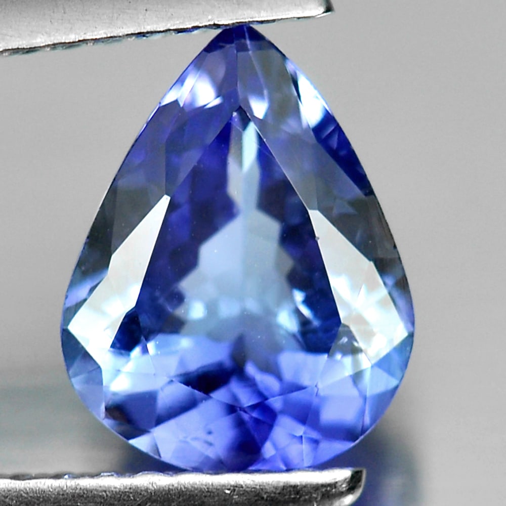Natural Violetish Blue Tanzanite 1.48 Ct. Pear Shape 9 x 7 Mm. Gemstone From Tanzania: Product ID: 807009470 Product Name: Natural Tanzanite Weight: 1.48 CT. Size: 9 x 7 x 3.8 MM. Shape: Pear Color: Violet Blue Clarity:SI Luster: Good Gems Origin: Tanzania Treatment: Heated Crystal Stru