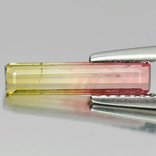 Natural Unheated Bi Color Tourmaline 0.87 Ct. Octagon Shape 12.8 x 3 x 2.2 Mm. Gemstone: Product ID: 807241098 Product Name: Natural Tourmaline Weight: 0.87 CT. Size: 12.8 x 3 x 2.2 MM. Shape: Octagon Color: Bi Color Clarity:SI Luster: Good Gems Origin: Nigeria Treatment: Unheated Crystal