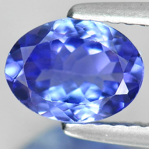 Natural Violetish Blue Tanzanite 1.17 Ct. VVS Oval Shape 7.8 x 5.9 Mm. Gemstone From Tanzania: Product ID: 807009079 Product Name: Natural Tanzanite Weight: 1.17 CT. Size: 7.8 x 5.9 x 3.3 MM. Shape: Oval Color: Violetish Blue Clarity:VVS Luster: Good Gems Origin: Tanzania Treatment: Heated Crys