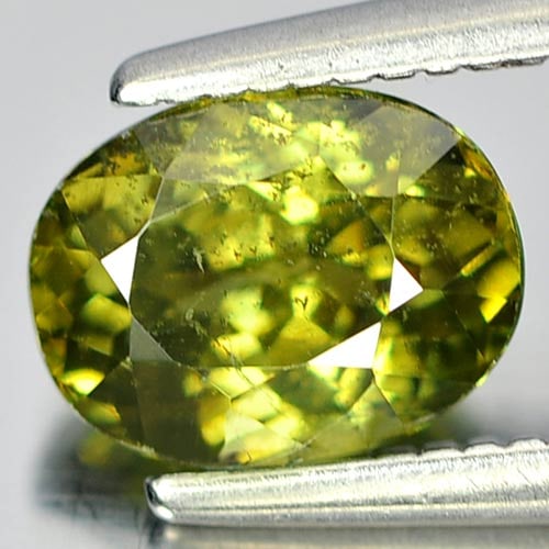 Natural Unheated Green Demantoid Garnet 1.26 Ct. Oval Shape 6.9 x 5.3 Mm. Gemstone From Madagascar: Product ID: 802922222 Product Name: Natural Demantoid Weight: 1.26 CT. Size: 6.9 x 5.3 x 3.4 MM. Shape: Oval Color: Green Clarity:SI1 Luster: Very Good Gems Origin: Mardagascar Treatment: Unheated Cry
