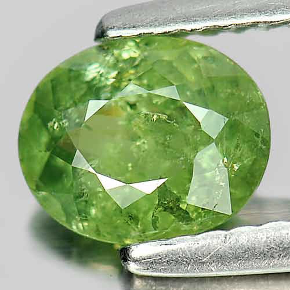 Natural Demantoid Garnet Green 1.06 Ct. Oval Shape 6.8 x 5.6 Mm. Gemstone Unheated: Product ID: 802919219 Product Name: Natural Demantoid Weight: 1.06 CT. Size: 6.8 x 5.6 x 3.3 MM. Shape: Oval Color: Green Clarity:SI1 Luster: Good Gems Origin: Madagascar , Africa Treatment: Unheated 