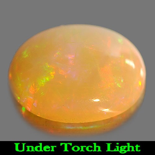 Natural Multi Color Play Of Colour Opal 1.05 Ct. Oval Cabochon Shape 9.2 x 7.1 Mm Gemstone From: Product ID: 818725314 Product Name: Natural Opal Weight: 1.05 CT. Size: 9.2 x 7.1 x 3.5 MM. Shape: Oval Cabochon Color: Multi Color Clarity:Semi - Transparent Luster: Iridescent Gems Origin: Ethiopia 