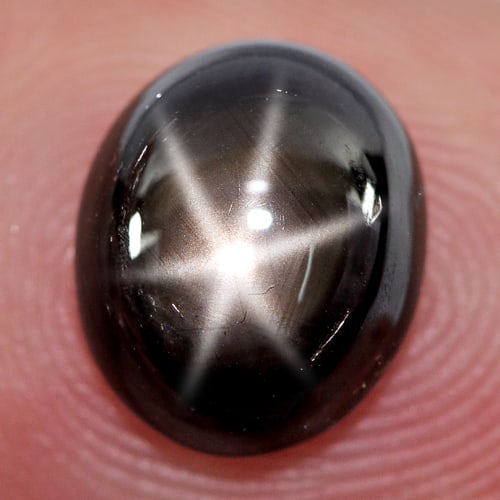 Natural Black Star Sapphire 6 Rays 3.79 Ct. Oval Cabochon Shape 9.7 x 8.2 Mm. Gemstone From Thailand: Product ID: 806137125 Product Name: Natural Star Sapphire Weight: 3.79 CT. Size: 9.7 x 8.2 x 4.4 MM. Shape: Oval Cabochon Color: Black Clarity:Opaque Luster: Good 6 Rays Star Gems Origin: Thailand Tre