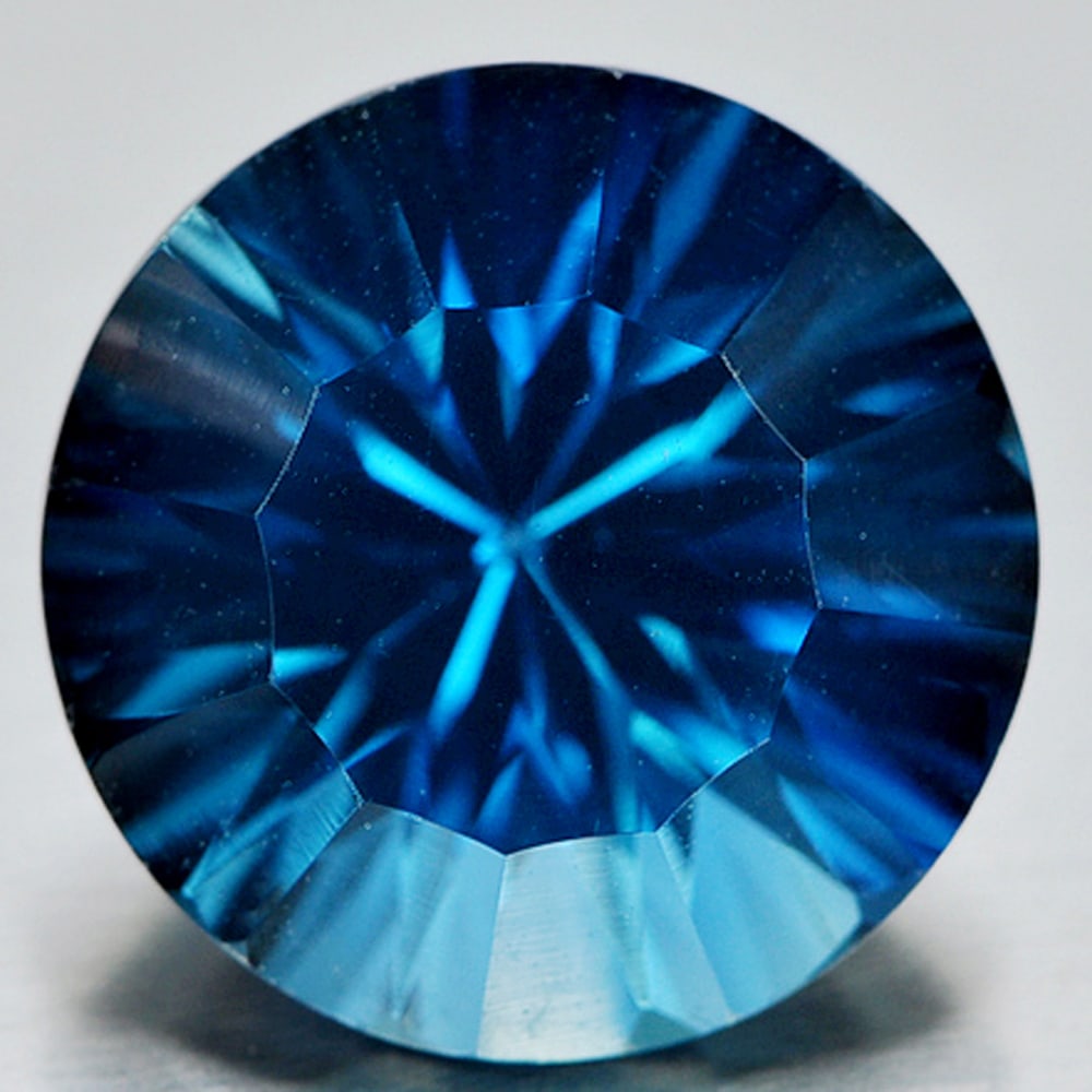 Natural London Blue Topaz 7.19 Ct. VVS Round Concave Cut 12.1 Mm. Gemstone From Brazil: Product ID: 807146418 Product Name: Natural Blue Topaz Weight: 7.19 CT. Size: 12.1 x 12.1 x 8.1 MM. Shape: Round Concave Cut Color: Blue Clarity:VVS Luster: Good Gems Origin: Brazil Treatment: Treated