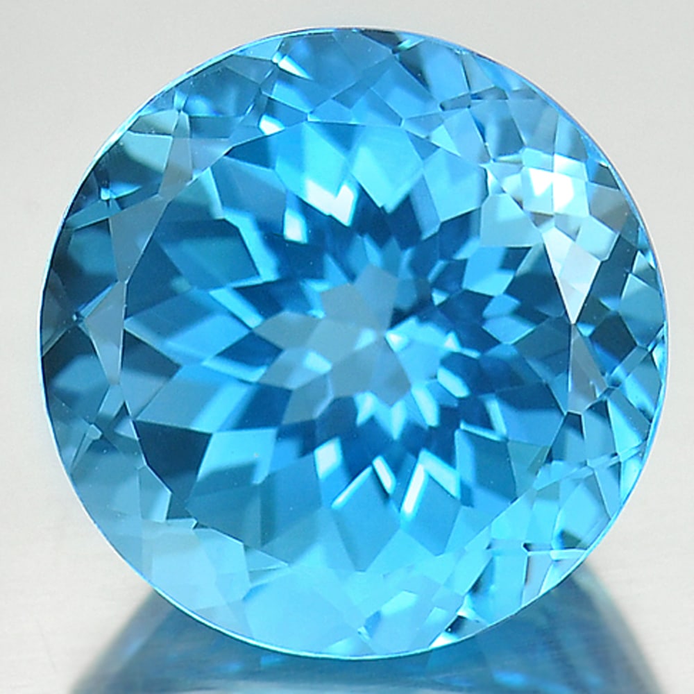 Natural Swiss Blue Topaz 15.18 Ct. Clean Round Cornflower Cut Shape 15 Mm. Gemstone From Brazil: Product ID: 807166777 Product Name: Natural Blue Topaz Weight: 15.18 CT. Size: 15 x 15 x 10.2 MM. Shape: Round Color: Blue Clarity:IF Luster: Very Good Gems Origin: Brazil Treatment: Treated Crystal S