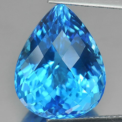 Natural Swiss Blue Topaz 16.06 Ct. Clean Pear Checkerboard Cut 17 x 13.5 Mm. Gemstone From Brazil: Product ID: 807165855 Product Name: Natural Blue Topaz Weight: 16.06 CT. Size: 17 x 13.5 x 11 MM. Shape: Pear Checkerboard Color: Blue Clarity:IF Luster: Very Good Gems Origin: Brazil Treatment: Treat