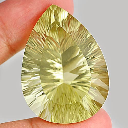 Natural Yellow Lemon Quartz 77.63 Ct. Clean Pear Concave Cut Shape 37 x 25 Mm. Unheated Gemstone: Product ID: 805526354 Product Name: Natural Quartz Weight: 77.63 CT. Size: 37 x 25 x 17.7 MM. Shape: Pear Concave Cut Color: Yellow Clarity:IF Luster: Very Good Gems Origin: Brazil Treatment: Unheated
