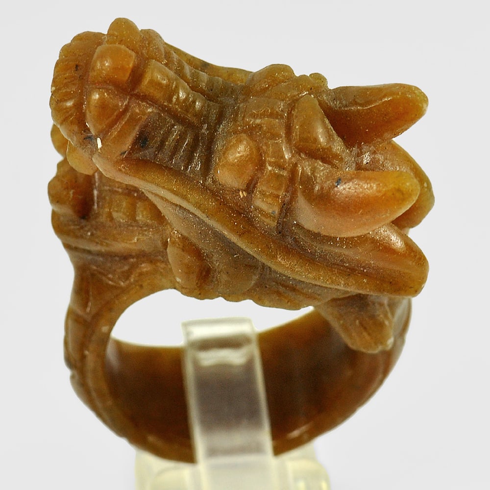 Natural Honey Jade 86.47 Ct. Dragon Carving Ring Size 10 Unheated Gemstone From Thailand: Product ID: 819814571 Product Name: Natural Jade Weight: 86.47 CT. Size: 42 x 20 MM. Shape: Dragon Color: Brown Clarity:Opaque Luster: Good Gems Origin: Thailand Treatment: Unheated Crystal Structure: