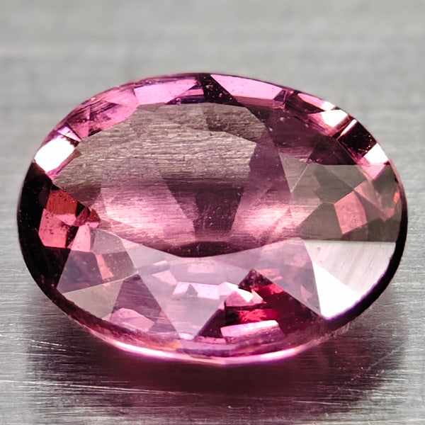Natural Pink Rhodolite Garnet 0.56 Ct. Oval Shape 5.6 x 4.6 Mm Gemstone From Madagascar: Product ID: 102906869 Product Name: Natural Rhodolite Weight: 0.56 CT. Size: 5.6 x 4.6 x 2.4 MM. Shape: Oval Color: Pink Clarity:IF Luster: Good Gems Origin: Madagascar Treatment: Unheated Crystal Str