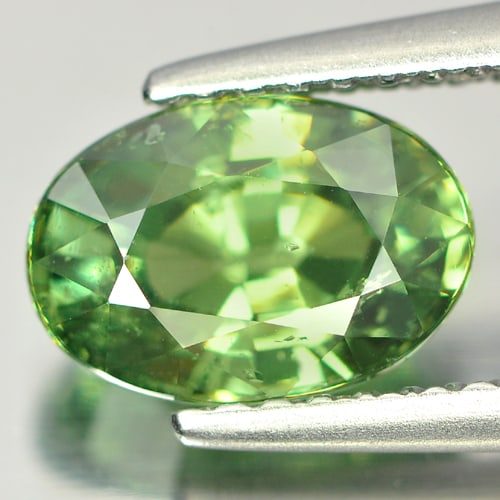 Certified Unheated Natural Demantoid Garnet 1.89 Ct. Oval Shape 8.49 x 5.88 Mm Gemstone: Product ID: 802913304 Product Name: Natural Demantoid Weight: 1.89 CT. Size: 8.49 x 5.88 x 4.42 MM. Shape: Oval Color: Green Clarity:SI1 Luster: Very Good Gems Origin: Madagascar Treatment: Unheated C