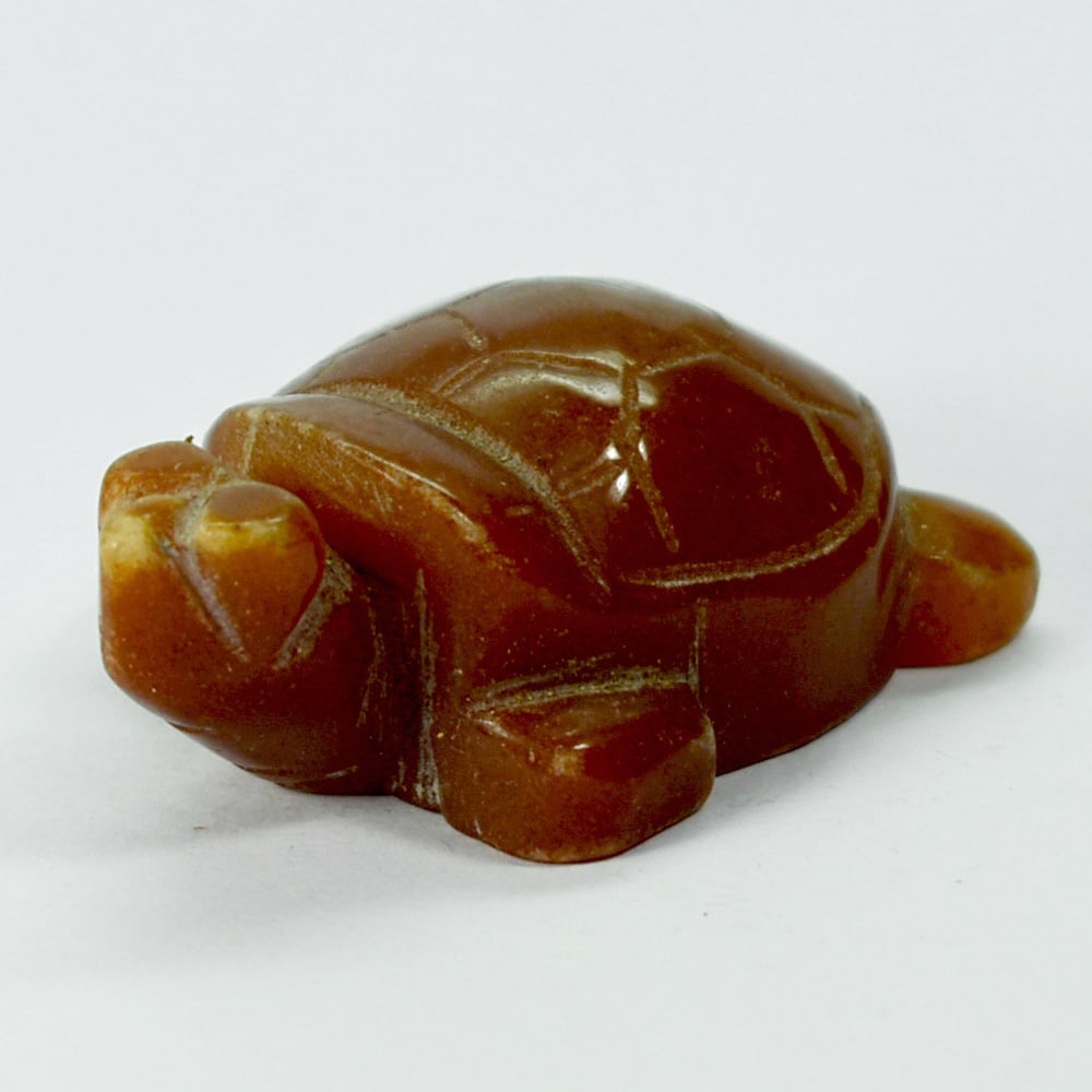 Natural Honey Jade 217.65 Ct. Turtle Carving Size 35 x 50 x 20 Mm. From Burma: Product ID: 818102431 Product Name: Natural Gemstones Weight: 217.65 CT. Size: 35 x 50 x 20 MM. Shape: Caving Color: multi Color brown Honey Clarity:Opaque Luster: Good Gems Origin: Burma Treatment: U