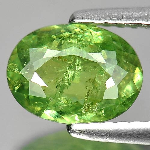 Natural Demantoid Garnet 1.29 Ct. Oval Shape 8.2 x 6 Mm. Gemstone Unheated From Madagascar: Product ID: 802919190 Product Name: Natural Demantoid Weight: 1.29 CT. Size: 8.2 x 6 x 2.9 MM. Shape: Oval Color: Green Clarity:SI Luster: Good Gems Origin: Madagascar , Africa Treatment: Unheated Cry