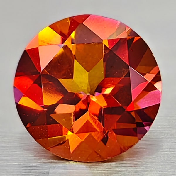 Natural Cracking Fire Color Topaz 0.93 Ct. Clean Round Shape 6.2 Mm Gemstone From Brazil: Product ID: 807167836 Product Name: Natural Topaz Weight: 0.93 CT. Size: 6.2 x 6.2 x 3.8 MM. Shape: Round Color: Cracking Fire Clarity:IF Luster: Very Good Gems Origin: Brazil Treatment: Treated Cryst