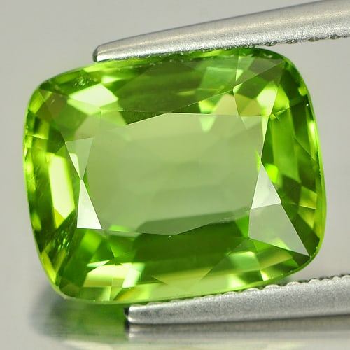 Natural Green Peridot 5.19 Ct. VVS Cushion Shape 11.9 x 9.7 Mm. Unheated Gemstone From Thailand: Product ID: 805313080 Product Name: Natural Peridot Weight: 5.19 CT. Size: 11.9 x 9.7 x 5.4 MM. Shape: Cushion Color: Green Clarity:VVS Luster: Very Good Gems Origin: Thailand Treatment: Unheated Crys
