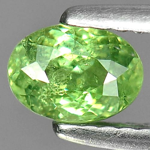 Natural Green Demantoid Garnet 0.76 Ct. Oval Shape 6.2 x 4.5 Mm. Gemstone From Madagascar: Product ID: 802919272 Product Name: Natural Demantoid Weight: 0.76 CT. Size: 6.2 x 4.5 x 3.5 MM. Shape: Oval Color: Green Clarity:SI Luster: Good Gems Origin: Madagascar , Africa Treatment: Unheated C