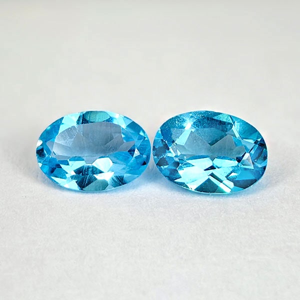 Natural Swiss Blue Topaz 1.84 Ct. 2 Pcs. Oval Shape 7 x 5 Mm. Gemstones From Brazil: Product ID: 807167804 Product Name: Natural Blue Topaz Weight: 1.84 CT. Size: 7 x 5 x 3.5 MM. Shape: Oval Color: Swiss Blue Clarity:VSI Luster: Good Gems Origin: Brazil Treatment: Treated Crystal Stru