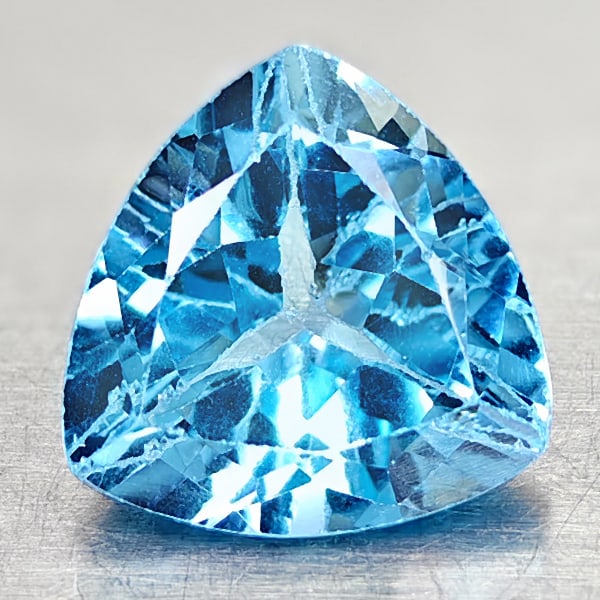 Natural Swiss Blue Topaz 3.34 Ct. Trilliant Shape 9.1 Mm Gemstone From Brazil: Product ID: 807167862 Product Name: Natural Blue Topaz Weight: 3.34 CT. Size: 9.1 x 9.1 x 5.7 MM. Shape: Trilliant Color: Swiss Blue Clarity:VSI Luster: Good Gems Origin: Brazil Treatment: Treated Cry