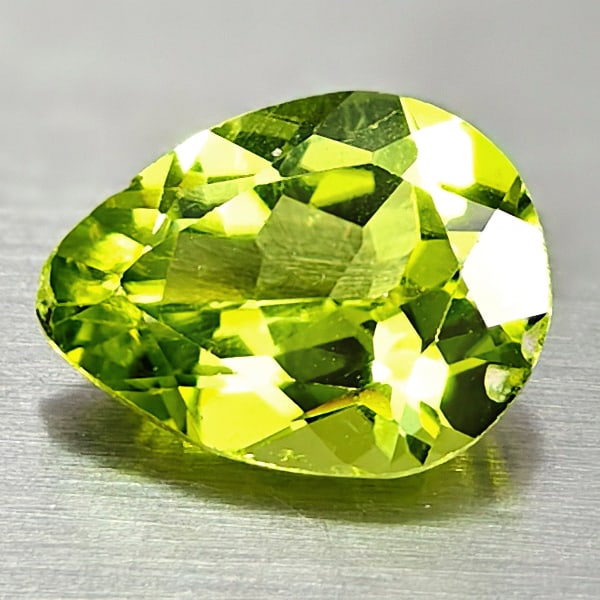 Natural Green Peridot 1.73 Ct. Pear Shape 9 x 6.8 Mm. Gemstone From Pakistan: Product ID: 805317005 Product Name: Natural Weight: 1.58 CT. Size: 9 x 6.8 x 4 MM. Shape: Pear Color: Green Clarity:VSI Luster: Good Gems Origin: Pakistan Treatment: Unheated Crystal Structure: Hardne