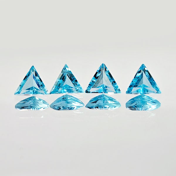 Natural Swiss Blue Topaz 2.06 Ct. 4 Pcs. Trilliant Shape 5.5 x 5.5 Mm. Gemstones From Brazil: Product ID: 807167768 Product Name: Natural Blue Topaz Weight: 2.06 CT. Size: 5.5 x 5.5 x 2.8 MM. Shape: Trilliant Color: Blue Clarity:VVS Luster: Good Gems Origin: Brazil Treatment: Treated Crystal S