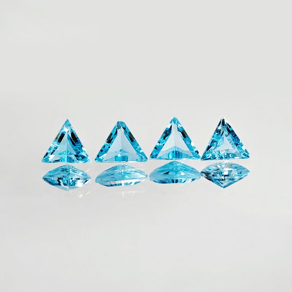 Natural Swiss Blue Topaz 2.03 Ct. 4 Pcs. VVS Trilliant Shape 5.3 x 5.3 Mm. Gemstones From Brazil: Product ID: 807167780 Product Name: Natural Blue Topaz Weight: 2.03 CT. Size: 5.3 x 5.3 x 2.9 MM. Shape: Trilliant Color: Blue Clarity:VVS Luster: Good Gems Origin: Brazil Treatment: Treated Crystal S