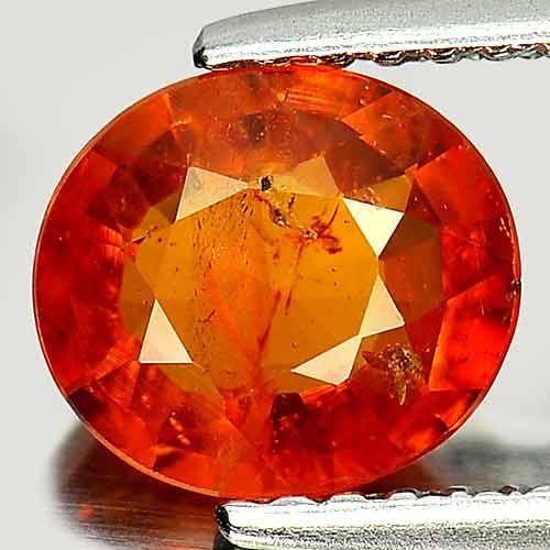 Natural Reddish Orange Spessartine Garnet 1.55 Ct. Oval Shape 7.5 x 6.7 Mm. Gemstone from Nigeria: Product ID: 802916736 Product Name: Natural Spessartine Weight: 1.55 CT. Size: 7.5 x 6.7 x 3.3 MM. Shape: Oval Color: Reddish Orange Clarity:SI Luster: Good Gems Origin: Nigeria Treatment: Unheated Cr