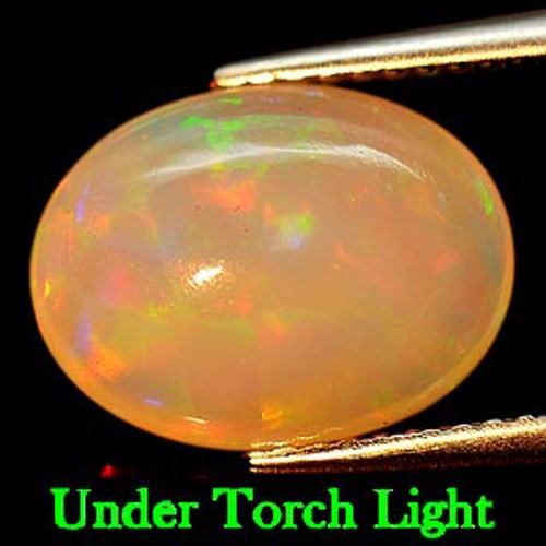Natural Multi Color Play Of Color Opal 2.84 Ct. Oval Cabochon Shape 12.7 x 9.7 Mm Gemstone from: Product ID: 818721798 Product Name: Natural Opal Weight: 2.84 CT. Size: 12.7 x 9.7 x 5 MM. Shape: Oval Cabochon Color: Multi Color Clarity:Semi - Transparent Luster: Iridescent Gems Origin: Ethiopia T
