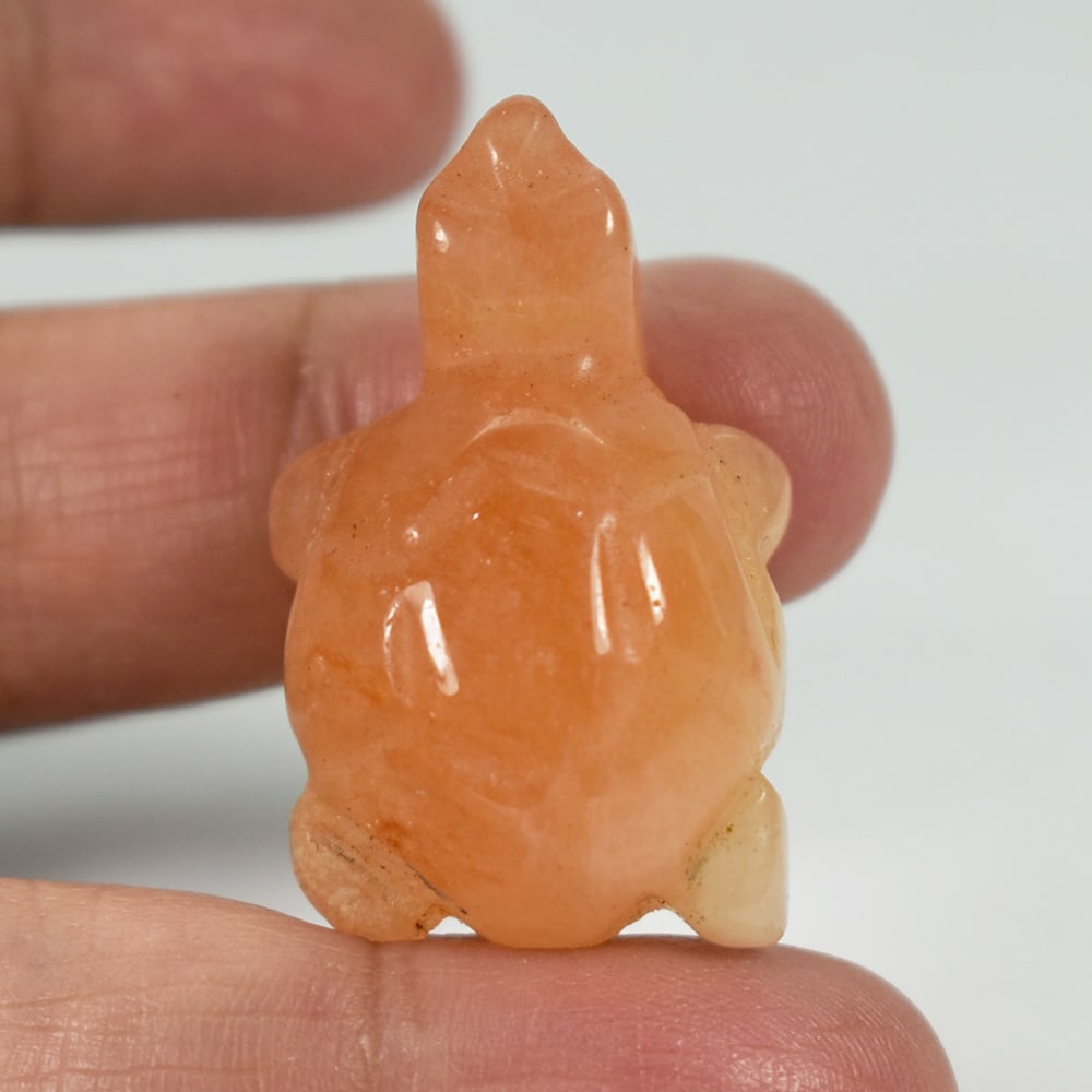 Natural Honey Jade 62.73 Ct. Turtle Carving Size 20 x 32 Mm. Gemstone From Burma: Product ID: 818102496 Product Name: Natural Gemstones Weight: 62.73 CT. Size: 20 x 32 x 14 MM. Shape: Caving Color: multi Color brown Honey Clarity:Opaque Luster: Good Gems Origin: Burma Treatment: Un