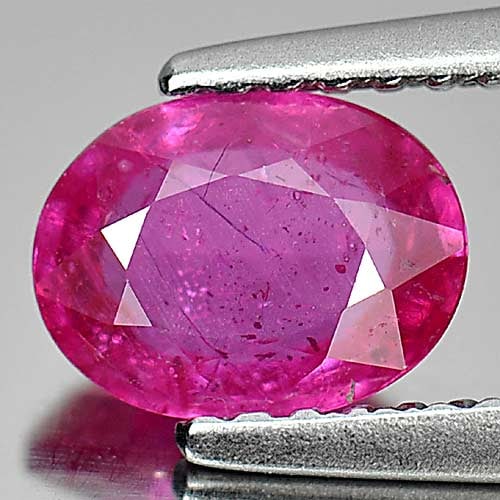 Natural Purplish Pink Ruby 1.11 Ct. Oval Shape 7.1 x 5.3 Mm. Gemstone From Mozambique: Product ID: 805920126 Product Name: Natural Ruby Weight: 1.11 CT. Size: 7.1 x 5.3 x 2.9 MM. Shape: Oval Color: Purplish Pink Clarity:VSI Luster: Good Gems Origin: Mozambique Treatment: Heated (Lead-gl