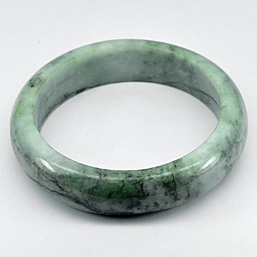 Natural Green Jade Bangle 437.85 Ct. Diameter 63 Mm. Unheated Gemstone From Thailand: Product ID: 819811326 Product Name: Natural Jade Weight: 437.85 CT. Size: 80 / 63 / 17 MM. Shape: Round Color: Green Clarity:Opaque Luster: Good Gems Origin: Thailand Treatment: Unheated Crystal Struc