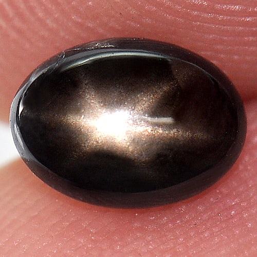 Natural Black Star 6 Rays Sapphire 1.28 Ct. Oval Cabochon Shape 7 x 5 Mm Gemstone From Thailand: Product ID: 806136426 Product Name: Natural Star Sapphire Weight: 1.28 CT. Size: 7 x 5 x 3 MM. Shape: Oval Cabochon Color: Black Clarity:Opaque Luster: Good 6 Rays Star Gems Origin: Thailand Treatment