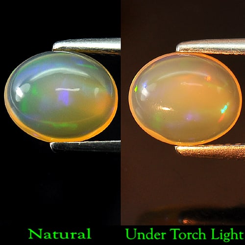 Natural Multi Color Opal 1.56 Ct. Oval Cabochon Shape 9.4 x 7.8 Mm. Gemstone: Product ID: 818707959 Product Name: Natural Opal Weight: 1.56 CT. Size: 9.4 x 7.8 x 4.2 MM. Shape: Oval Cabochon Color: Multi Color Clarity:Semi - Transparent Luster: Good Gems Origin: Ethiopia Treatm