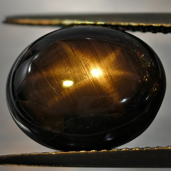 Natural Black Star Sapphire 9.17 Ct. Oval Cabochon Shape 12.7 x 10.1 Mm Gemstone From Thailand: Product ID: 106118441 Product Name: Natural Star Sapphire Weight: 9.17 CT. Size: 12.7 x 10.1 x 5.8 MM. Shape: Oval Cabochon Color: Black Clarity:Opaque Luster: Good 6 Lays Star Gems Origin: Thailand T