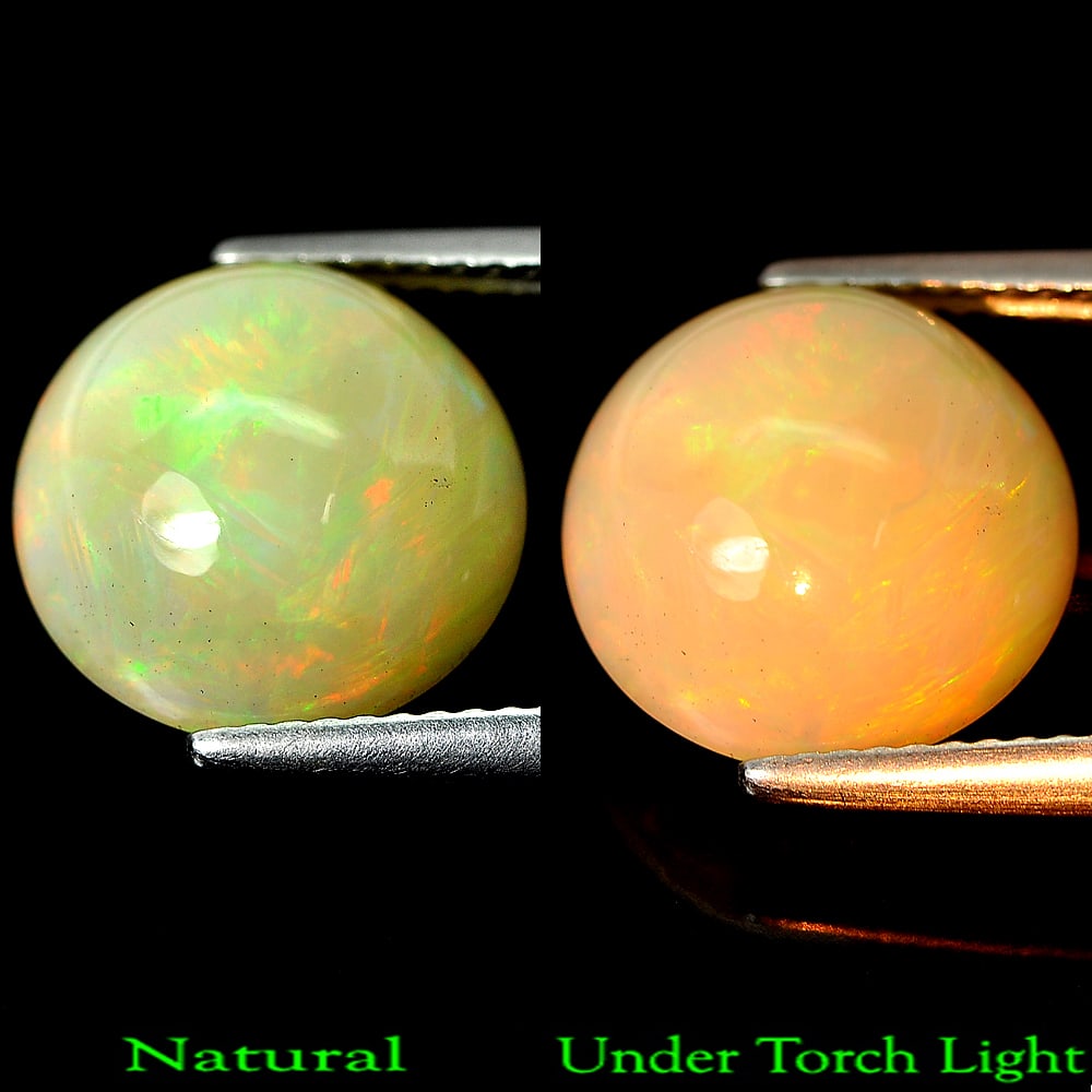 Natural Multi-Color Play Of Colour Opal 4.79 Ct. Round Cabochon Shape 12.1 Mm Gemstone From Ethiopia: Product ID: 818719094 Product Name: Natural Opal Weight: 4.79 CT. Size: 12.1 x 12.1 x 8.1 MM. Shape: Round Cabochon Color: Multi Color Clarity:Opaque Luster: Strong Iridescent Gems Origin: Ethiopia Tr