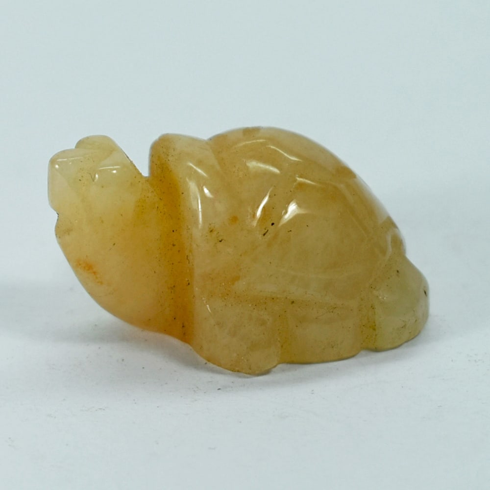 Natural Honey Jade 118.97 Ct. Turtle Carving Size 27 x 38 Mm. From Myanmar: Product ID: 818102412 Product Name: Natural Gemstones Weight: 106.75 CT. Size: 27 x 38 x 20 MM. Shape: Caving Color: multi Color brown Honey Clarity:Opaque Luster: Good Gems Origin: Burma Treatment: U