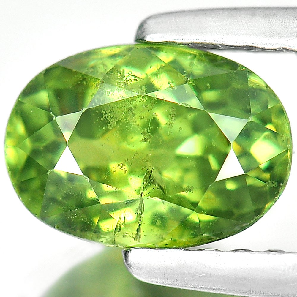 Natural Green Demantoid Garnet 1.49 Ct. Oval Shape 7.5 x 5.4 Mm. Natural Gemstone Unheated From: Product ID: 802915843 Product Name: Natural Demantoid Weight: 1.49 CT. Size: 7.5 x 5.4 x 4.4 MM. Shape: Oval Color: Green Clarity:SI1 Luster: Good Gems Origin: Madagascar , Africa Treatment: Unheated 