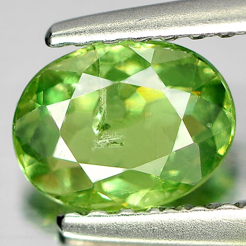 Natural Green Demantoid Garnet 0.76 Ct. Oval Shape 6.7 x 5.1 Mm. Gemstone From Madagascar: Product ID: 802935099 Product Name: Natural Demantoid Weight: 0.76 CT. Size: 6.7 x 5.1 x 2.6 MM. Shape: Oval Color: Green Clarity:SI1 Luster: Good Gems Origin: Madagascar Treatment: Unheated Crystal S