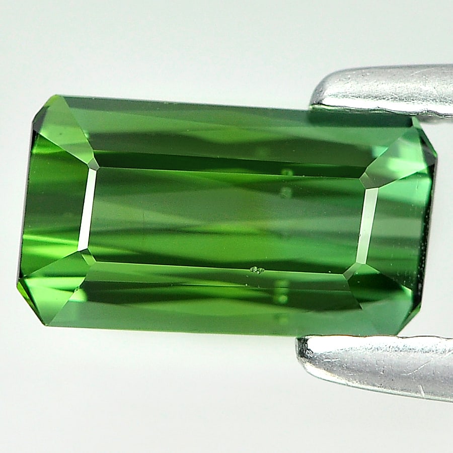 Natural Green Tourmaline 0.91 Ct. Octagaon Shape 7.9 x 4.4 Mm Gemstone from Nigeria: Product ID: 807224300 Product Name: Natural Tourmaline Weight: 0.91 CT. Size: 7.9 x 4.4 x 3 MM. Shape: Octagon Color: Green Clarity:VVS Luster: Good Gems Origin: Nigeria Treatment: Unheated Crystal St