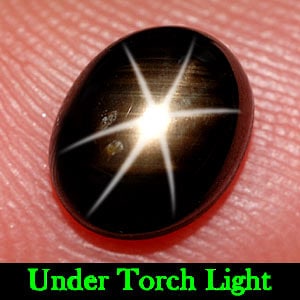 Natural Black Star Sapphire 6 Rays 2.52 Ct. Oval Cabochon Shape 8 x 6.5 Mm. Gemstone: Product ID: 806137167 Product Name: Natural Star Sapphire Weight: 2.52 CT. Size: 8 x 6.5 x 4.4 MM. Shape: Oval Cabochon Color: Black Clarity:Opaque Luster: Good 6 Rays Star Gems Origin: Thailand Treat