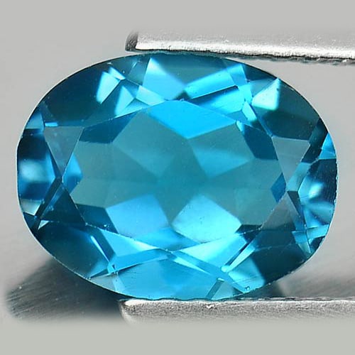 Natural London Blue Topaz 2.11 Ct. VVS Oval Shape 9 x 7 Mm. Gemstone From Brazil: Product ID: 807161700 Product Name: Natural Blue Topaz Weight: 2.11 CT. Size: 9 x 7 x 4.3 MM. Shape: Oval Color: London Blue Clarity:VVS Luster: Good Gems Origin: Brazil Treatment: Treated Crystal Str