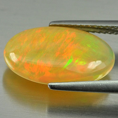 Natural Multi-Color Opal 3.19 Ct. Oval Cabochon Shape 16.6 x 9.8 Mm. Unheated Gemstone From Ethiopia: Product ID: 818727887 Product Name: Natural Opal Weight: 3.19 CT. Size: 16.6 x 9.8 x 4.3 MM. Shape: Oval Cabochon Color: Multi-Color Clarity:Semi - Transparent Luster: Iridescent Gems Origin: Ethiopia