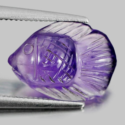 Natural Purple Amethyst 3.05 Ct. Fish Carving Size 13.2 x 9.7 Mm. Gemstone From Brazil: Product ID: 810304006 Product Name: Natural Amethyst Weight: 3.05 CT. Size: 13.2 x 9.7 x 5.1 MM. Shape: Fish Carving Color: Purple Clarity:Semi - Transparent Luster: Good Gems Origin: Brazil Treatment